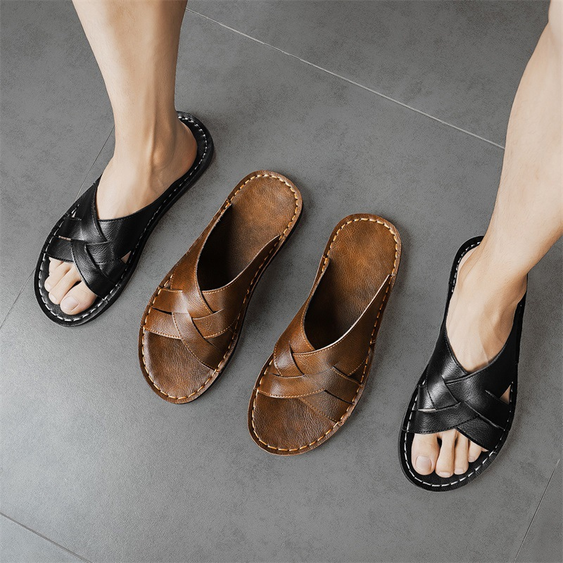 Men's comfortable slide sandals, black, with a cushioned sole and cross-strap design for casual wear.