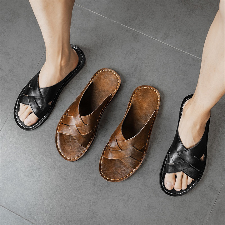 Men's comfortable slide sandals, black, with a cushioned sole and cross-strap design for casual wear.