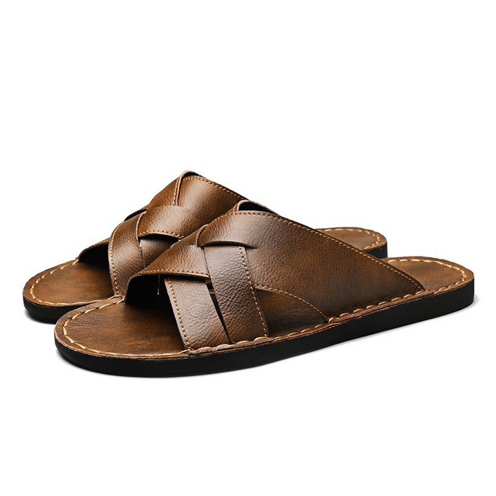 Durable men's slide sandals, offering a cushioned sole and stylish open-toe design for everyday summer comfort.