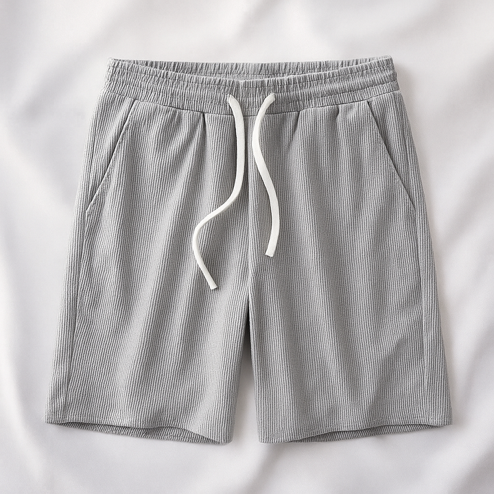 Soft men's waffle knit lounge shorts offering ultimate comfort for relaxed fit casual wear. Includes practical pockets.