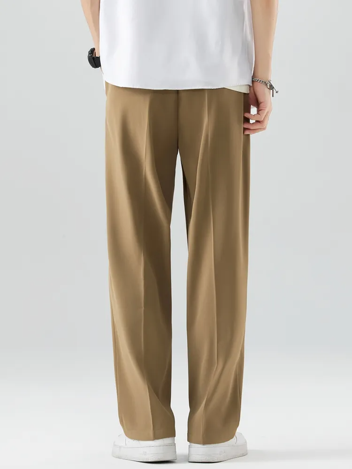 Men's athletic pants with elastic waist and tapered leg, providing a comfortable, modern relaxed fit.