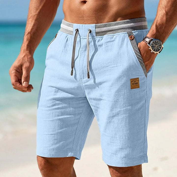 Men's casual relaxed fit summer shorts with elastic waist and drawstring for beach or vacation wear.