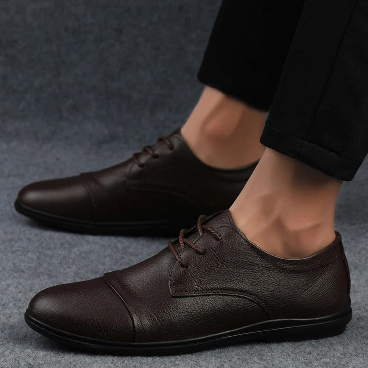 Men's comfortable work shoes, a sleek black design for the office and professional settings.