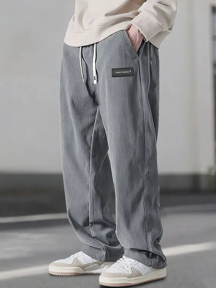 Textured corduroy men's cargo pants in navy blue, a versatile choice for casual fashion and everyday comfort.