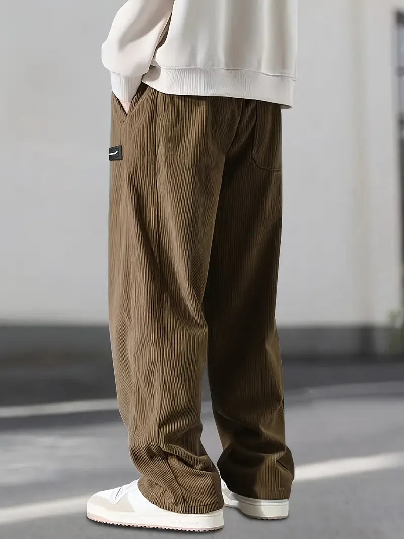 Back view of men's comfortable corduroy cargo pants, highlighting rear pockets & the relaxed fit.