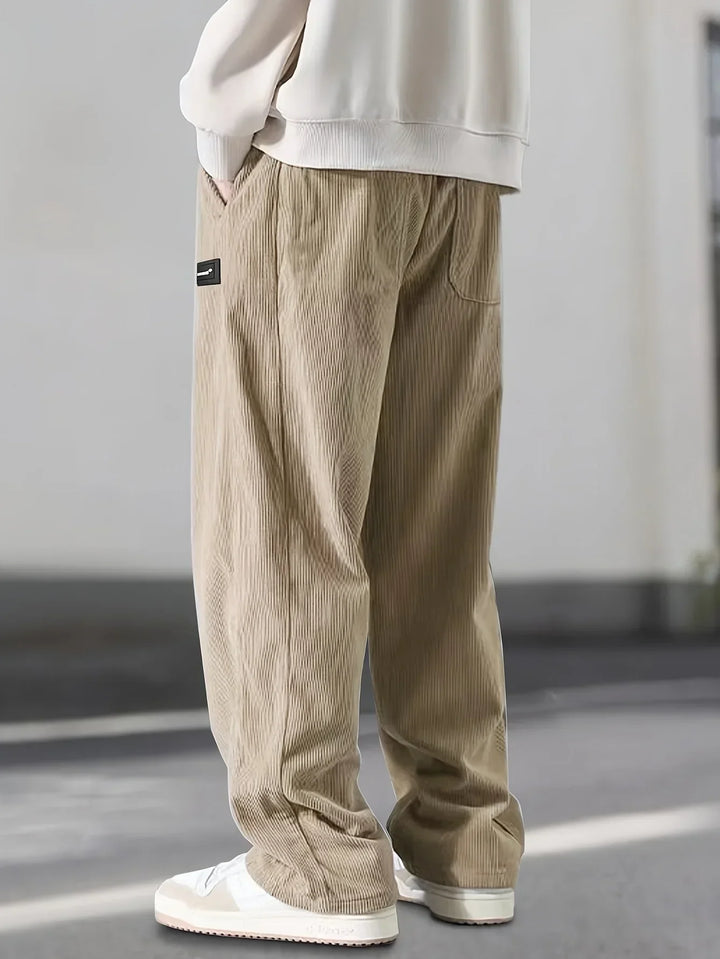 Man wearing comfortable relaxed fit corduroy cargo pants, ideal for versatile everyday men's fashion.