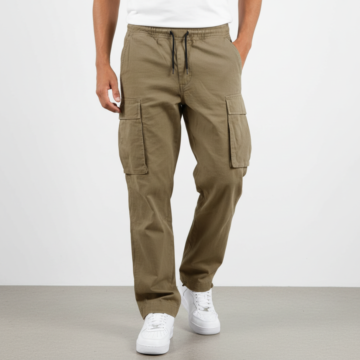 Close-up of the durable cotton fabric and cargo pockets on men's loungewear joggers.