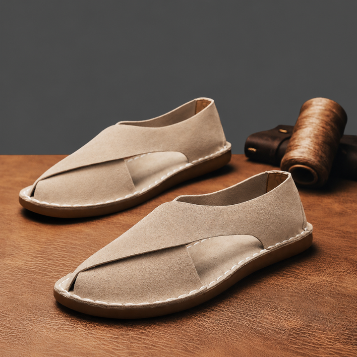 Stylish men's cross-strap flat sandals. Ideal for summer vacations, beach wear, or comfortable casual everyday footwear.