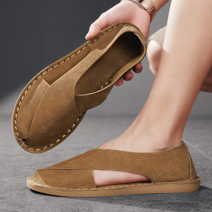 Comfortable men's flat sandals featuring cross-straps. Open-toe, slip-on casual footwear, great for summer & beach wear.