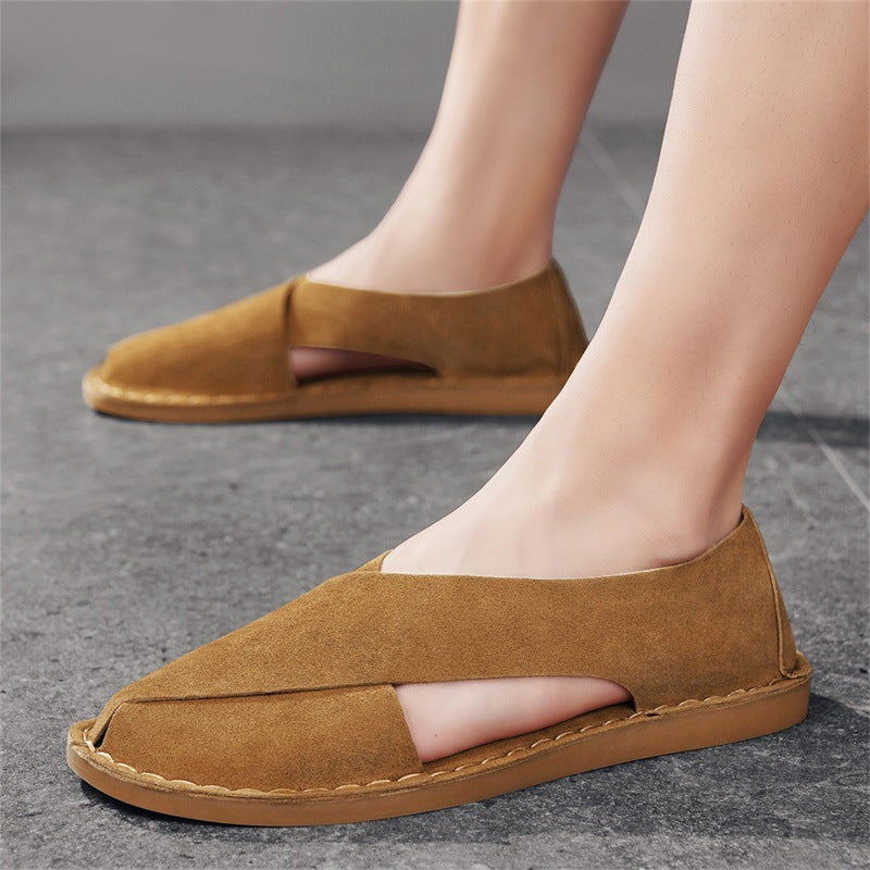Easy slip-on men's flat sandals with comfortable cross-straps. Open-toe design for relaxed summer days & beach trips.