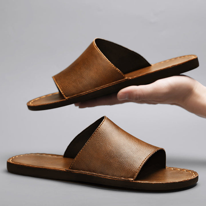 Comfortable men's cross-strap sandals, essential summer footwear for relaxed outdoor activities.