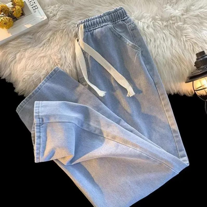 Men's casual denim jogger pants designed for all-day comfort, blending loungewear feel with streetwear style.