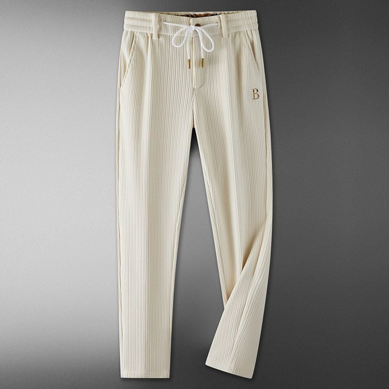 Men's comfortable light brown drawstring casual trousers in cotton blend for everyday wear.