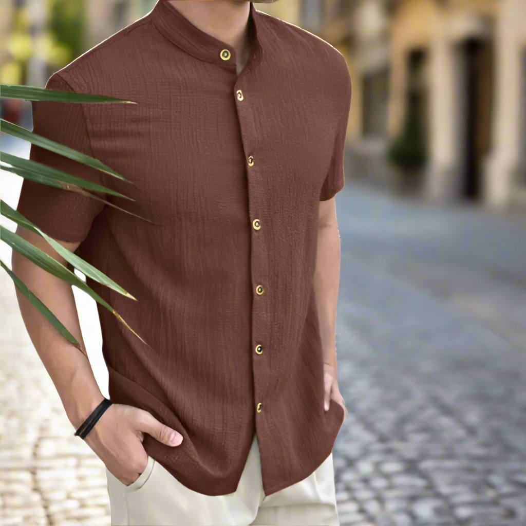 Stylish men's white linen button-up shirt, a versatile and casual summer top.