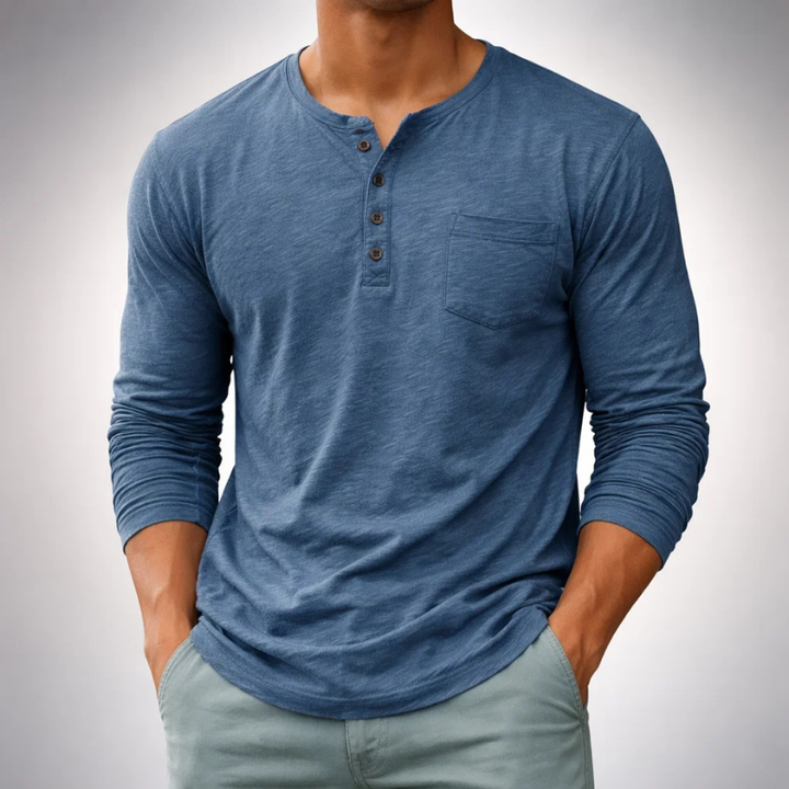 Close-up of soft fabric & button placket on a men's comfortable long sleeve henley shirt, versatile.