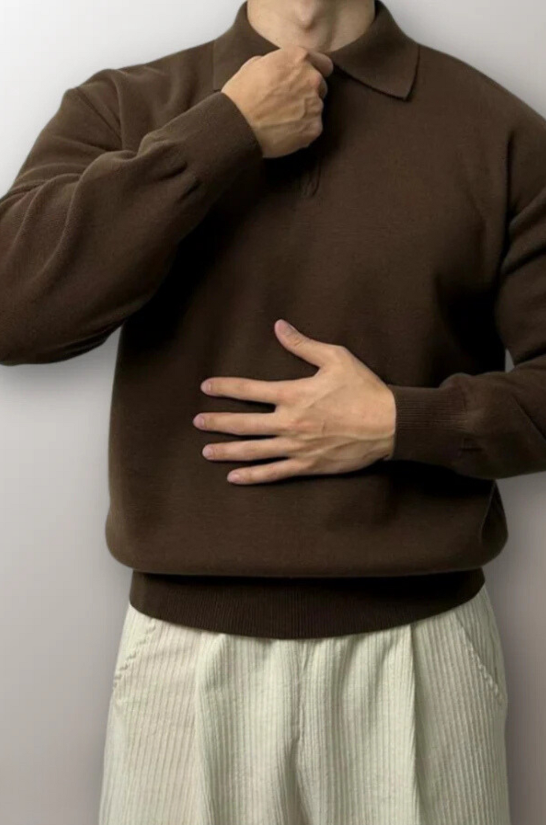 Stylish men's zip polo sweater, versatile long-sleeve knitwear for comfortable smart-casual fashion.