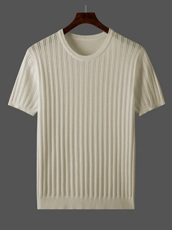 Man wearing stylish emerald green ribbed tee. Comfortable, versatile everyday fashion.