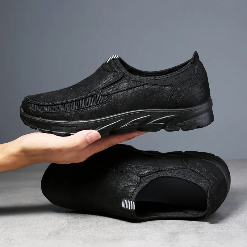Side view: Classic men's slip-on loafers, providing comfort & support for everyday walking & casual wear.