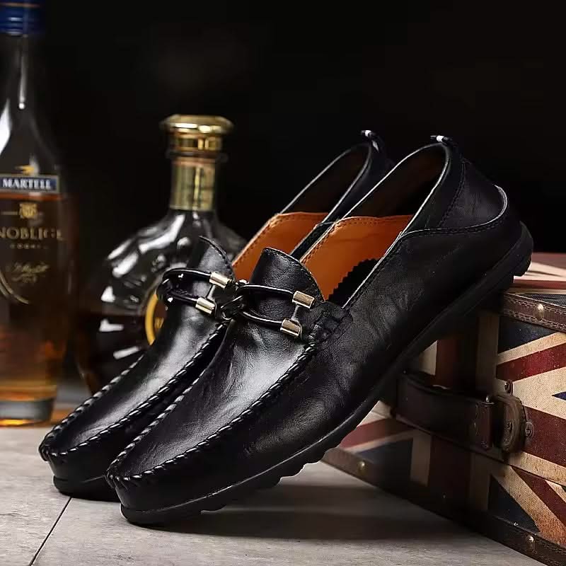 Stylish black men's slip-on loafers, a comfortable choice for dress or casual outfits.