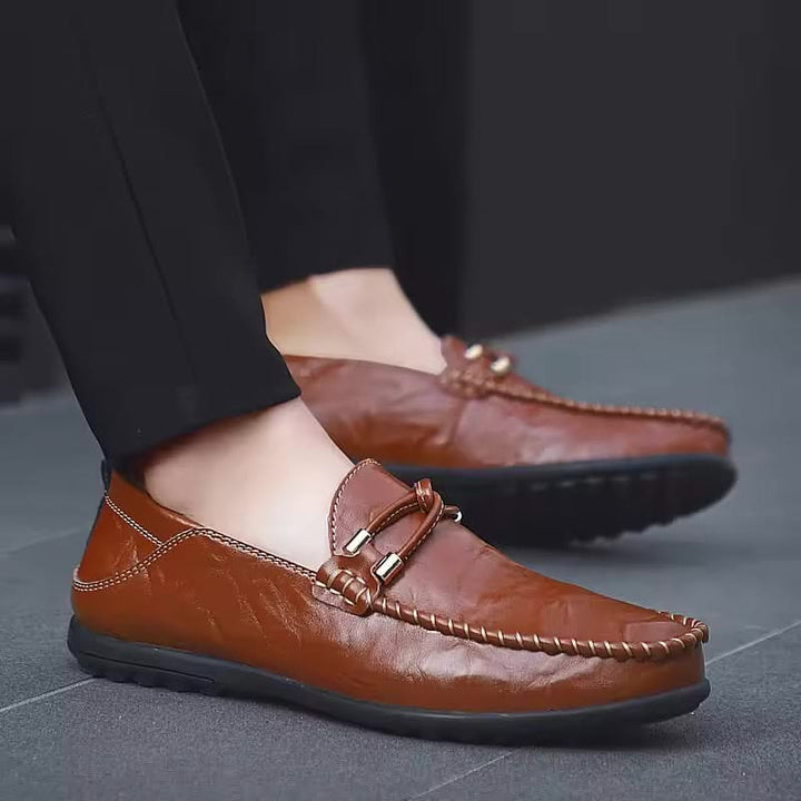 Elegant brown men's slip-on loafers, a comfortable and stylish choice for modern men.