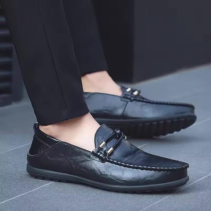 Black men's slip-on loafers, providing ultimate comfort and a sleek, versatile look.