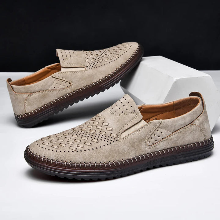 Breathable men's slip-on loafers with perforated design. Comfortable casual shoes for everyday wear.