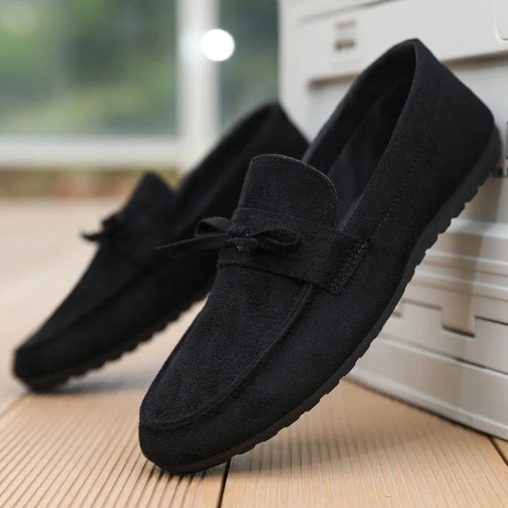 Men's stylish slip-on loafers with a distinctive bow, engineered for comfort and lightweight ease.