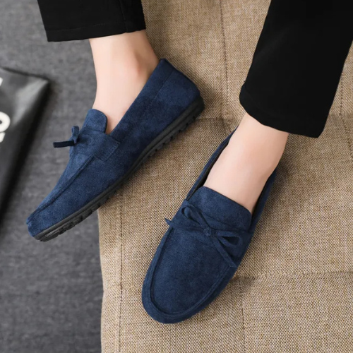 Side view of stylish men's loafers with a decorative bow, offering ultimate comfort and support.