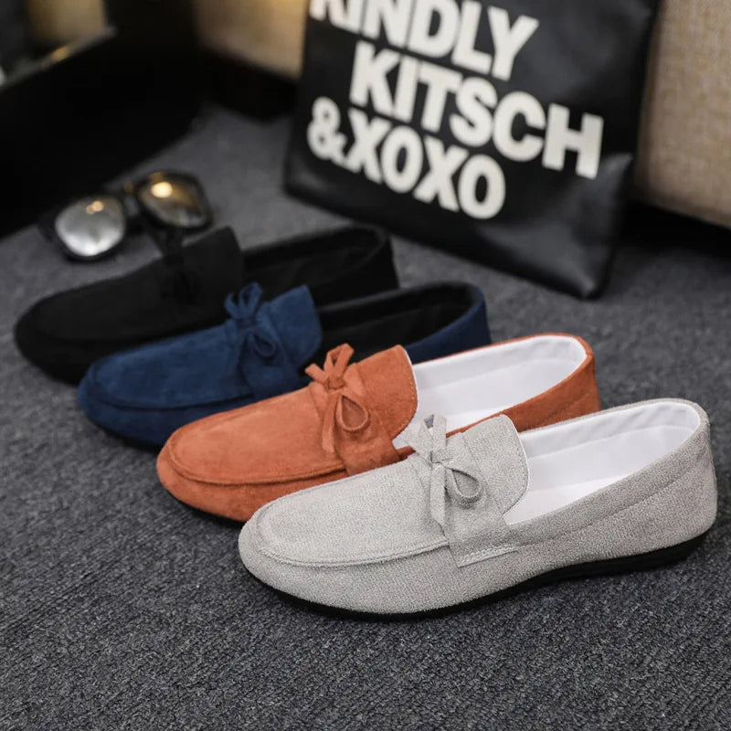 Front view of comfortable men's slip-on loafers with a decorative bow, perfect for any occasion.
