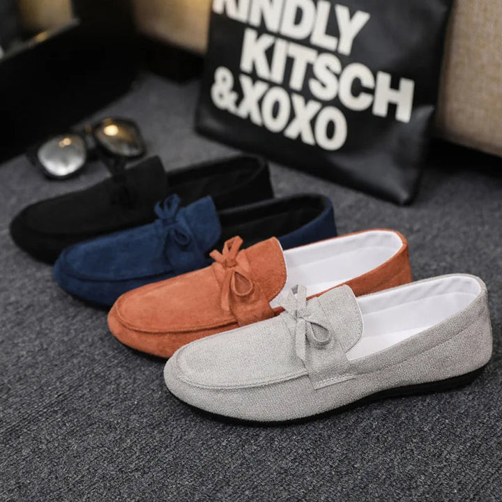 Front view of comfortable men's slip-on loafers with a decorative bow, perfect for any occasion.