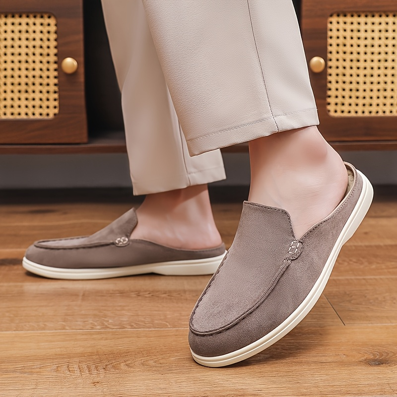 Modern men's slip-on mule loafers, combining comfort, style, and practicality for everyday casual footwear.
