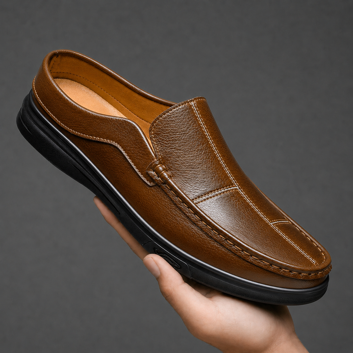 Brown men's slip-on mules with a durable sole, offering comfort and style for casual everyday wear.
