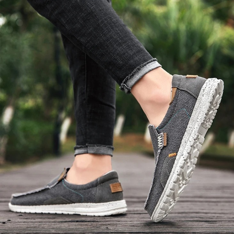 Side view of men's comfortable slip-on shoes with a durable sole, perfect for walking.