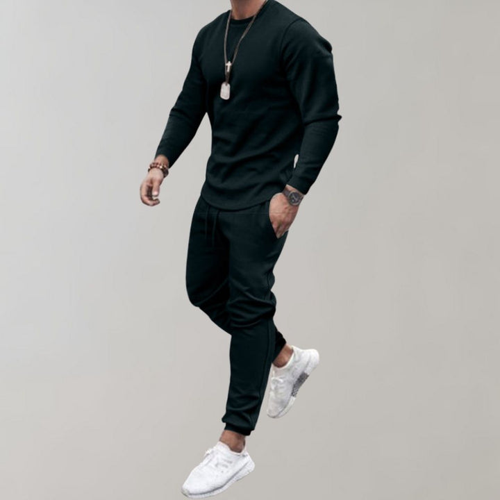 Polyester men's tracksuit set, offering comfort & style. Great for workouts, casual wear, or a relaxed sporty look.
