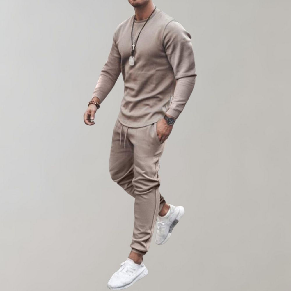 Modern men's sporty tracksuit. Comfortable athletic wear or casual outfit. Two-piece set for men's fashion.