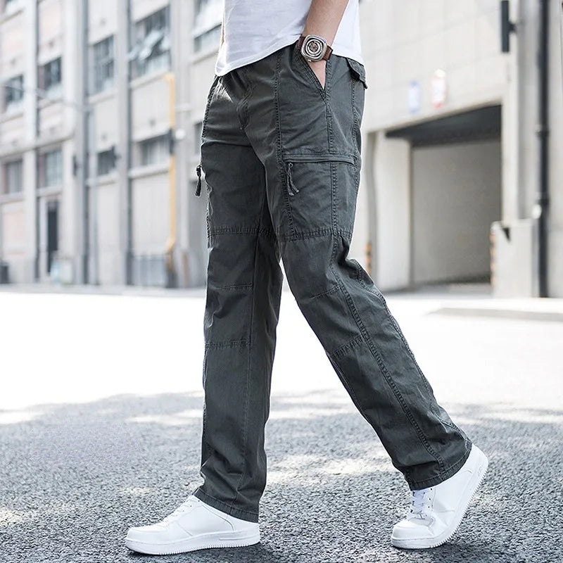 Green men's techwear cargo pants, combining comfort, utility, and modern fashion.