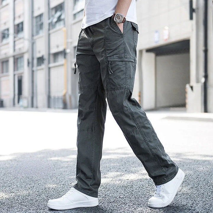 Green men's techwear cargo pants, combining comfort, utility, and modern fashion.