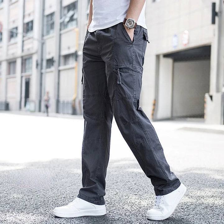 Black men's fashion cargo pants, comfortable techwear offering versatile everyday style.
