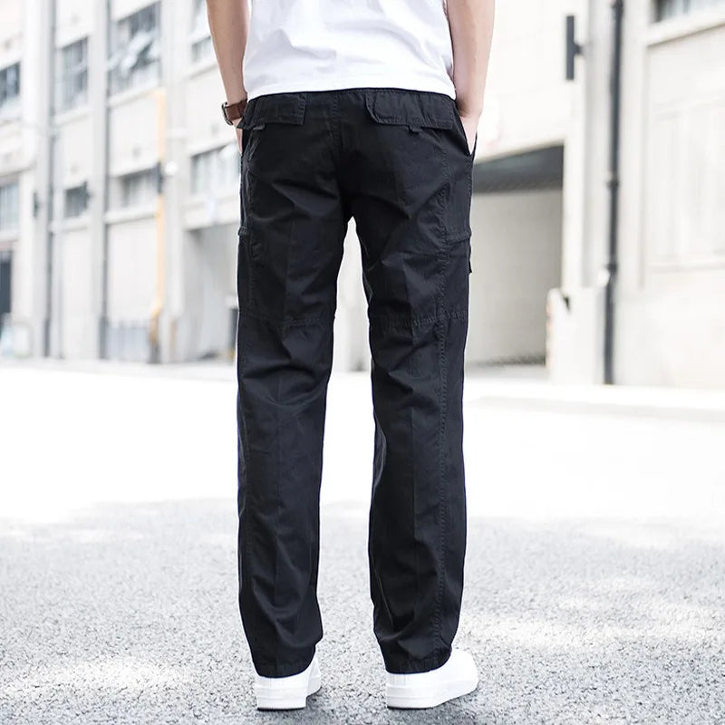 Close-up of men's multi-pocket comfortable tech cargo pants, highlighting practical utility.