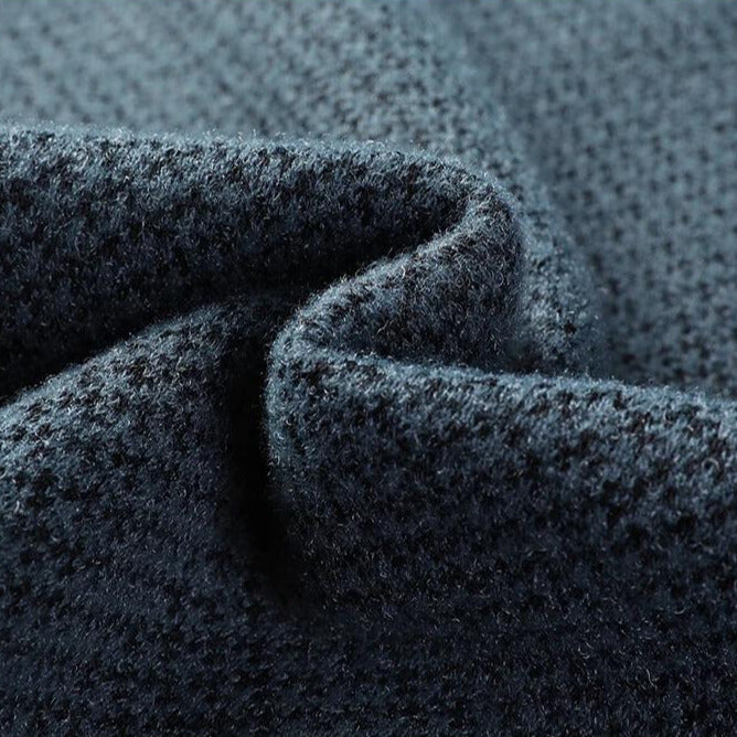 Cozy men's long-sleeve knit sweater featuring a stylish textured pattern, ensuring warmth and breathable comfort.