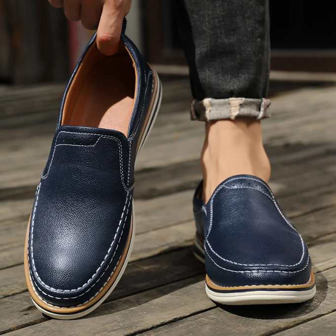Top-down view of men's Cooper Mocs loafers, showing comfortable footbed & versatile slip-on design.