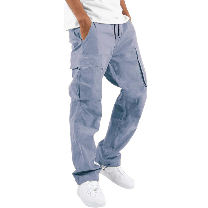 Close-up of the durable cotton fabric and cargo pockets on men's jogger pants