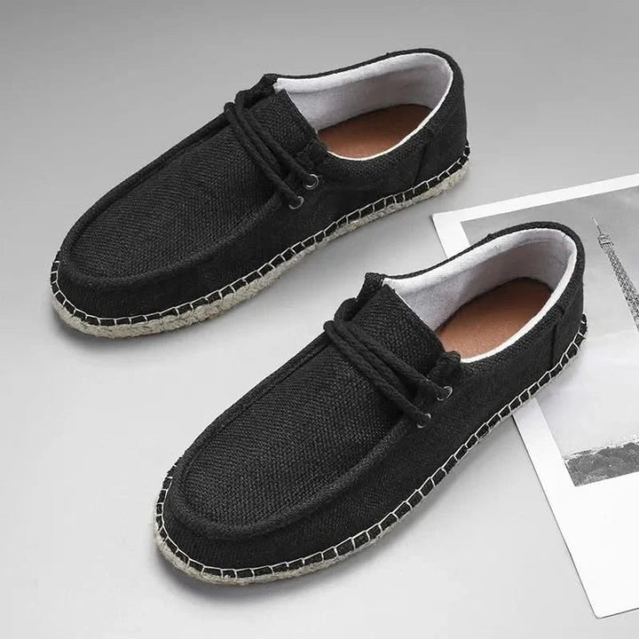 Close-up of Men's Cove slip-on loafers with textured braided upper, comfortable casual footwear.