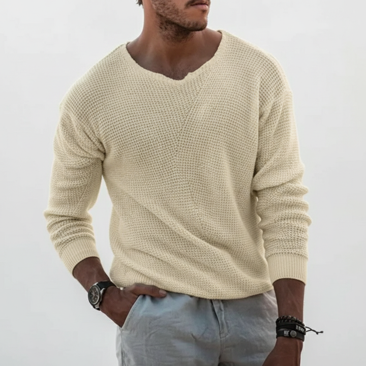 Detailed view of a men's Joseph knit sweater sleeve and cuff, emphasizing quality and comfort