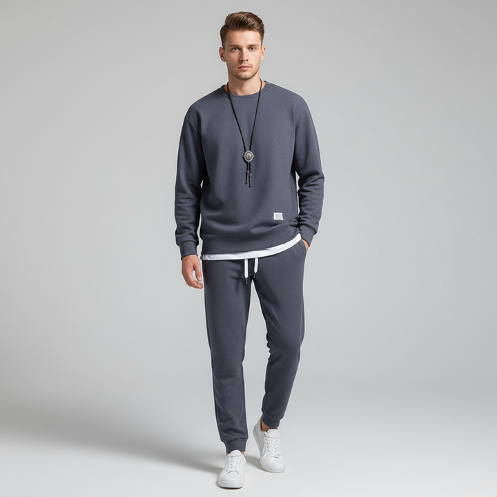 Men's black jogger pants from a two-piece tracksuit set, perfect for casual or active wear
