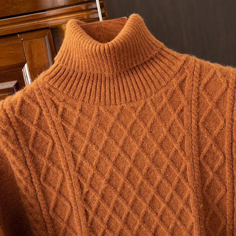 Man wearing a cozy diamond cable knit turtleneck sweater, a warm men's apparel item for winter.