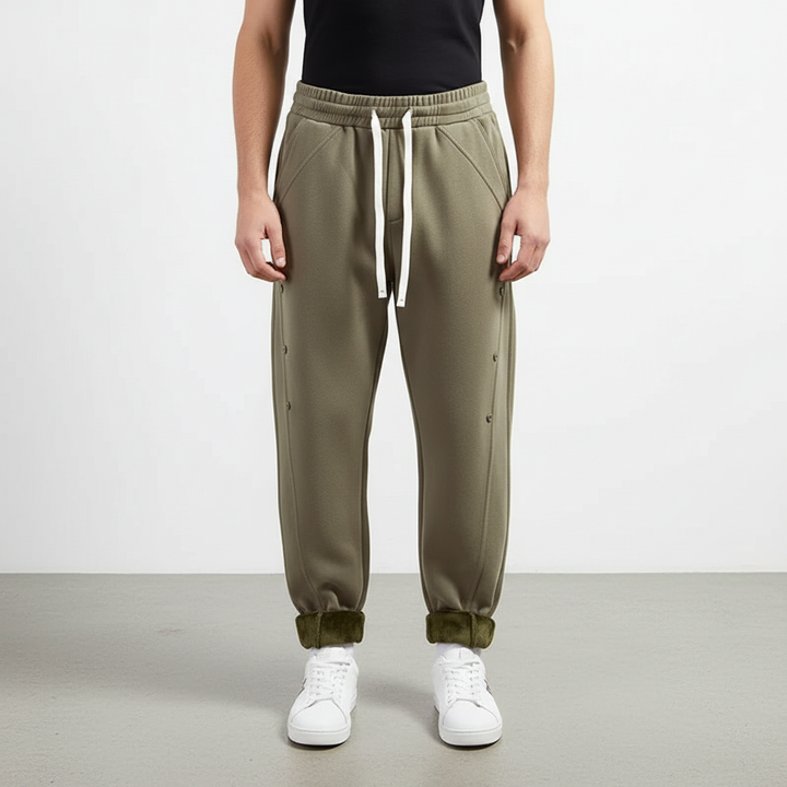 Stack of folded men's cozy fleece trousers in various colors, ideal for winter wear