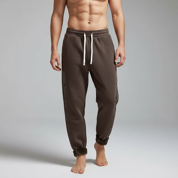 Detail shot of men's fleece jogging pants pocket, highlighting practical and cozy design