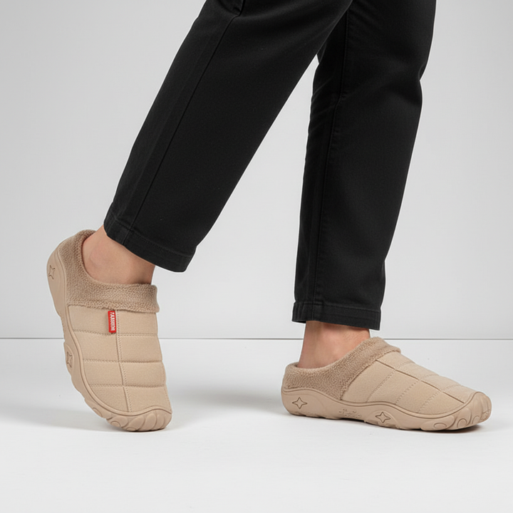 Soft fleece-lined men's slippers, tan color, providing warmth and comfort for indoor use