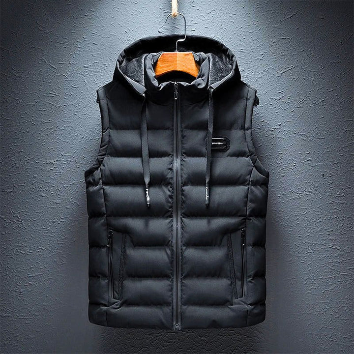 Padded men's hooded vest with full zipper & pockets. Lightweight, warm for outdoor activities & casual style.